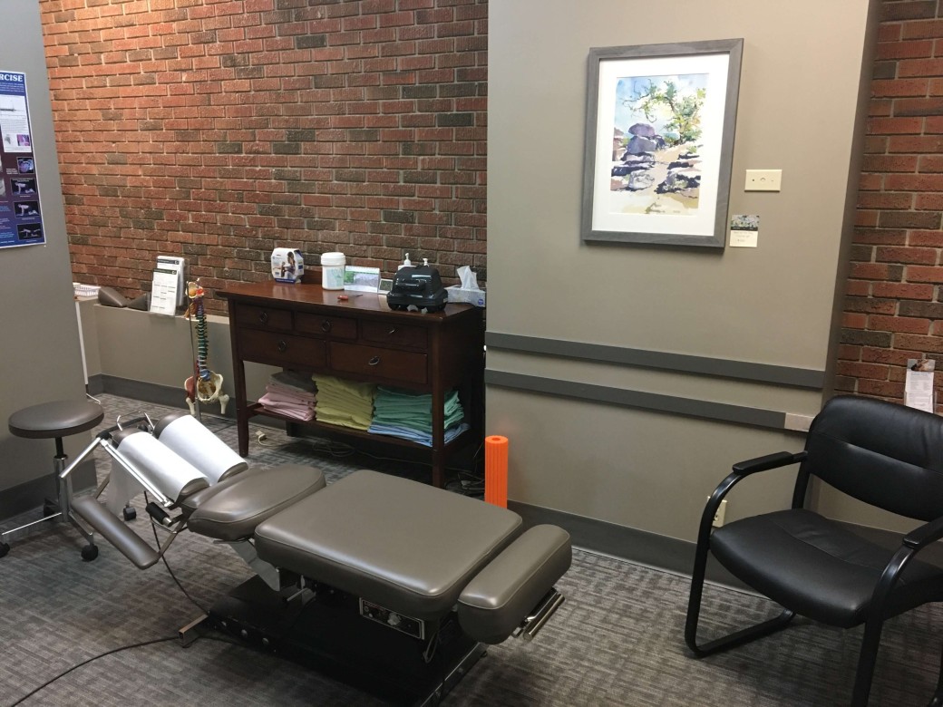 office room with chiropractor table